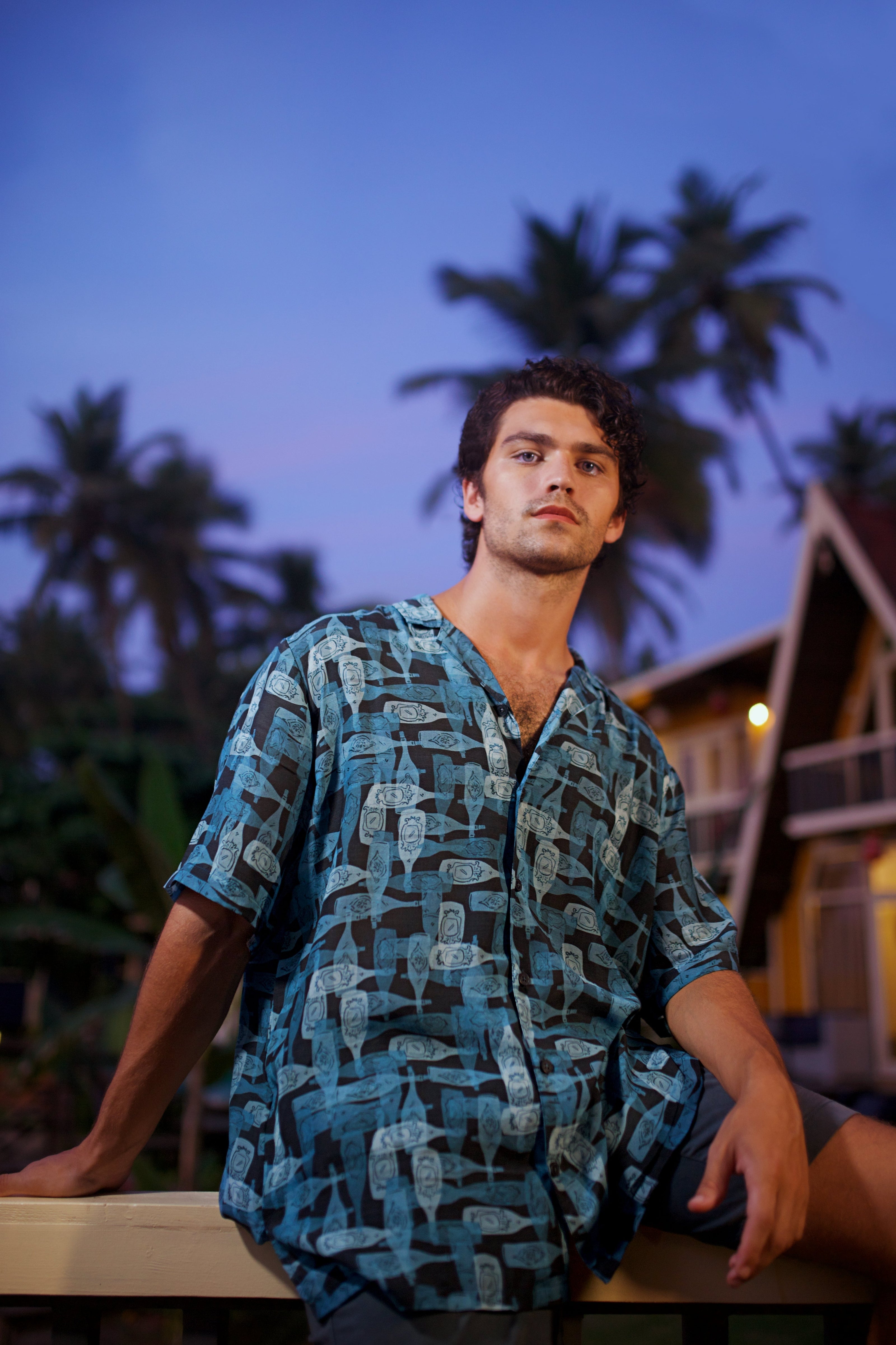 Men's trendy oversized button up shirt by Stylera in blue with abstract patterns, perfect for casual outings