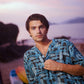 Men's trendy oversized button up shirt in blue with unique print, perfect for casual summer outings