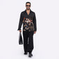 Stylera men's trendy statement shirt featuring an artistic print, paired with stylish black pants