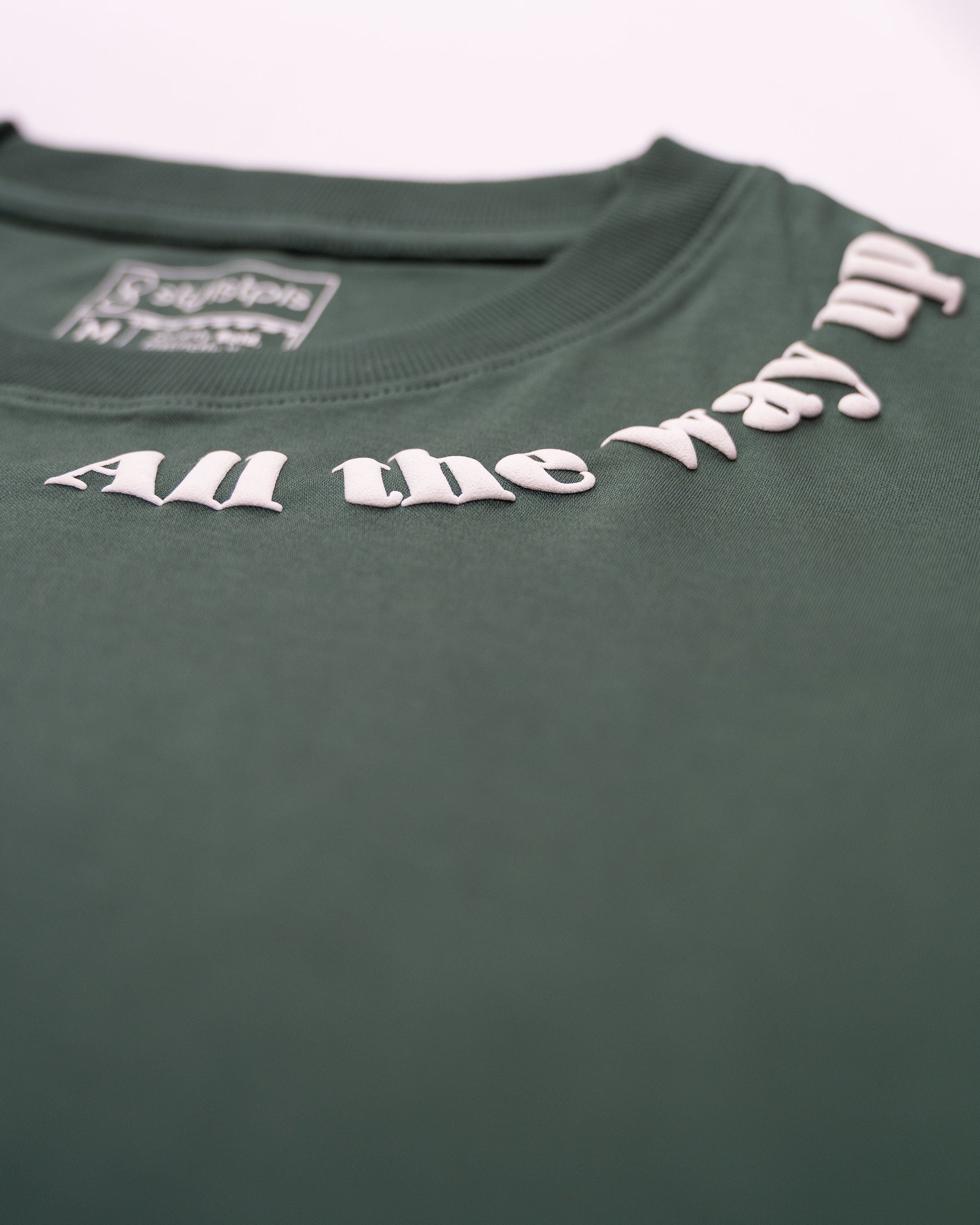 Stylstpls men's trendy streetwear t-shirt in green with unique text design on the neckline