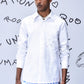Men's trendy white shirt by Stylera with subtle floral patterns and classic collar
