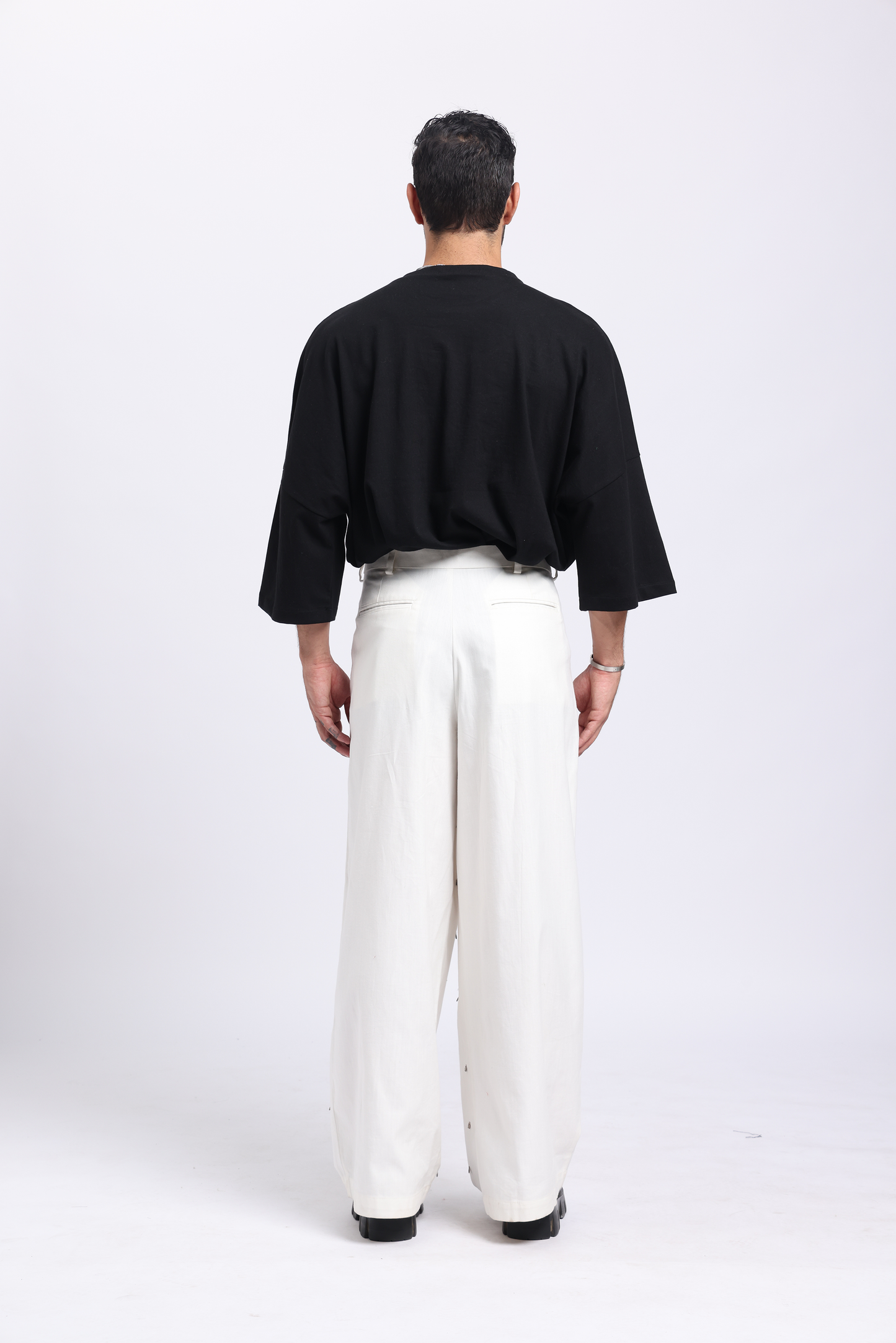 Stylera men's white closure pants featured in a relaxed fit, styled for modern casual wear