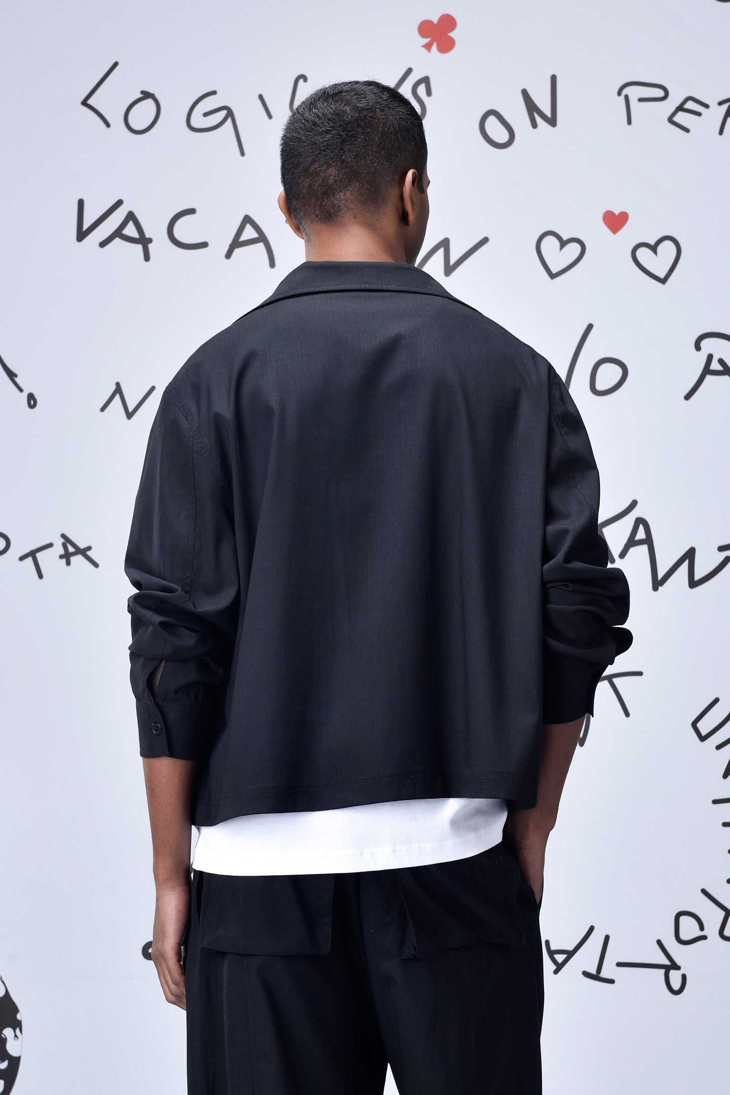 Stylera back view of model wearing black casual jacket men's over white shirt