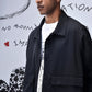 Stylera black casual jacket men's modeled on a man over white graphic tee with flap pockets and relaxed collar