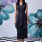 Stylera model wearing midi black dress with belt sleeveless V neck layered tunic