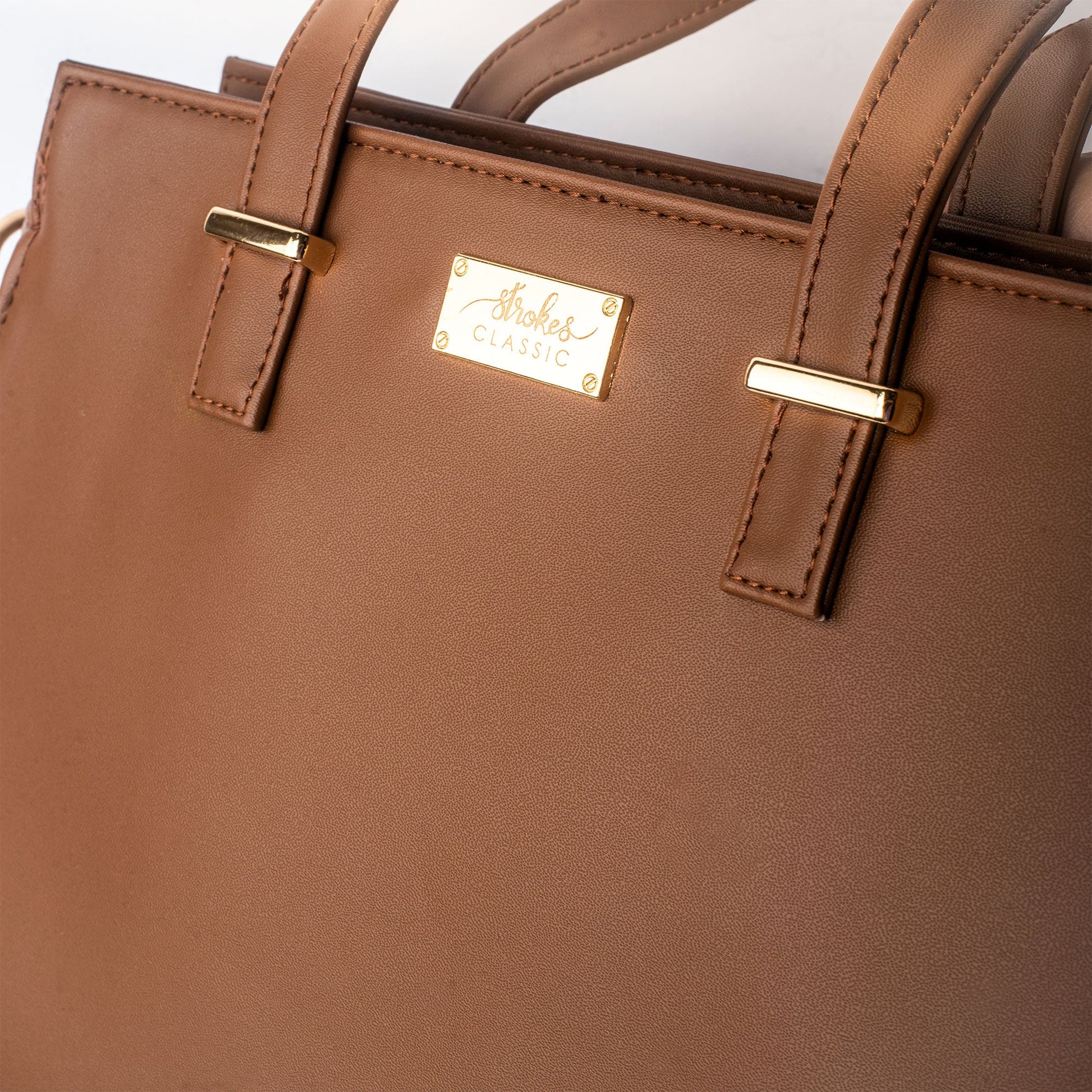 Mocha elegance handbag by Stylera, featuring stylish design and gold accents for a chic look