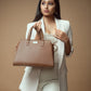 Mocha elegance handbag showcased by a model in a chic outfit, perfect for stylish outings