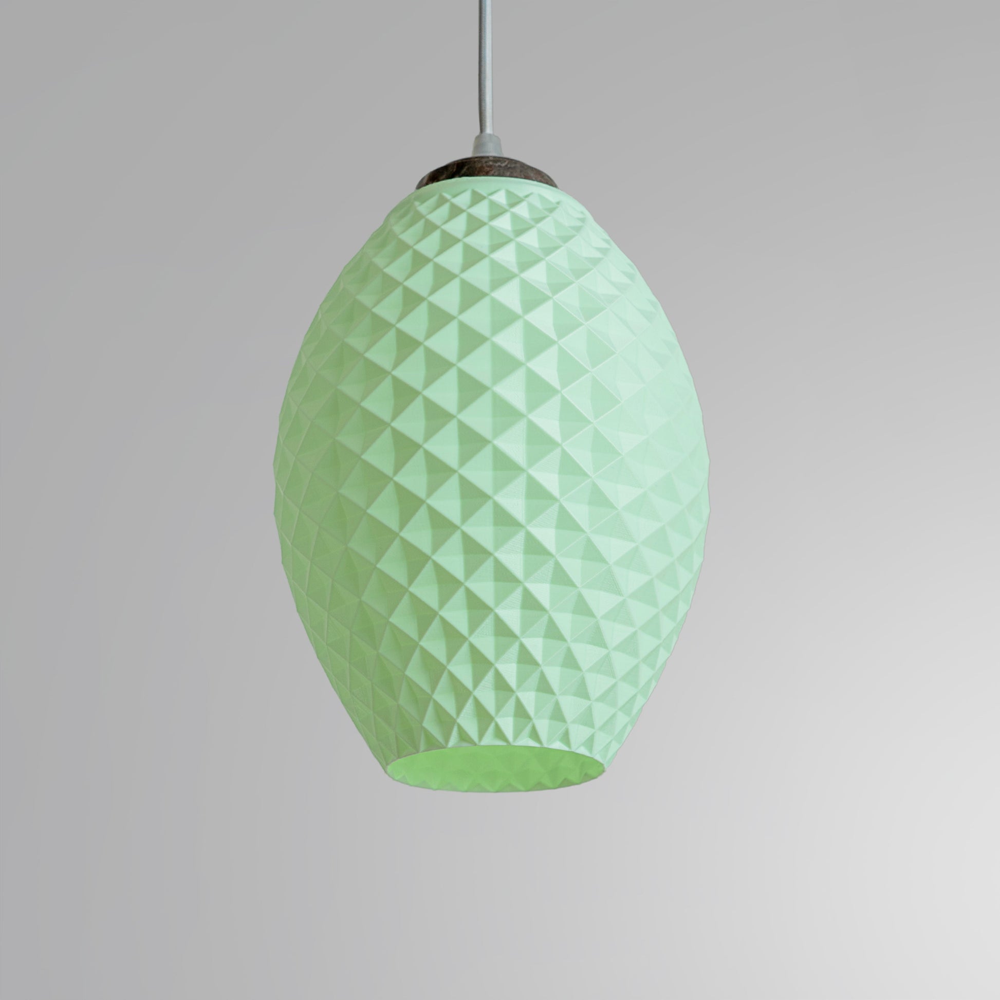 Modern pastel hanging lamp in light green with a textured design for stylish interior lighting