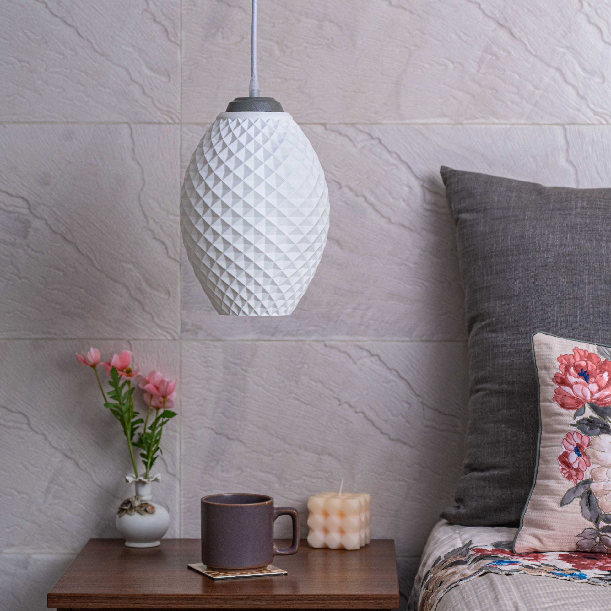 Sozori modern pastel hanging lamp with a textured design, illuminating a cozy living space