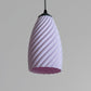 Stylish pink hanging lamp for modern pastel room decor lighting with a unique twisted design