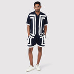 Modern short sleeve polo shirt for men in navy with bold white geometric patterns