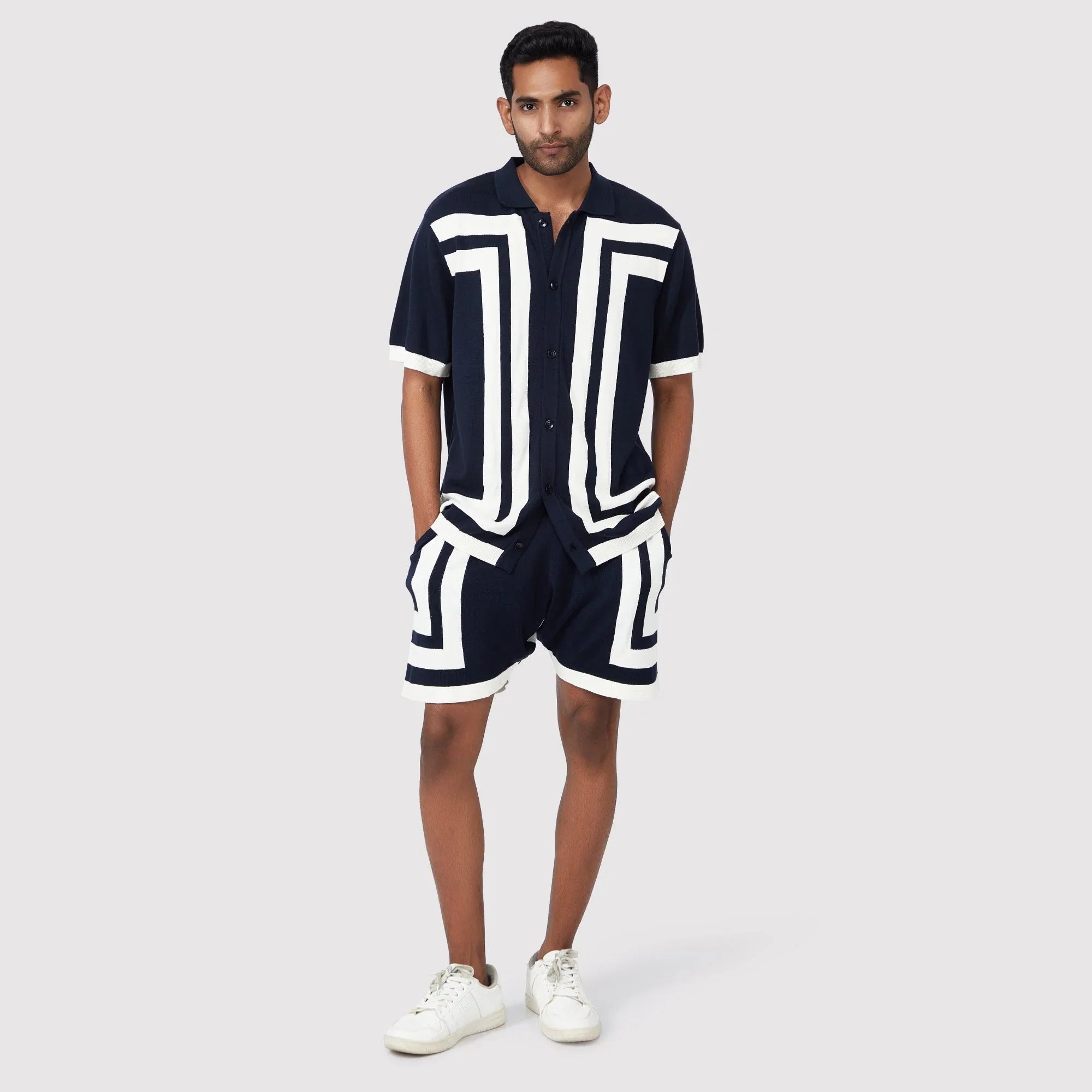 Modern short sleeve polo shirt for men in navy with bold white geometric patterns