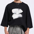 Stylera modern streetwear black t-shirt featuring a bold white abstract design on the front