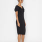 Stylera moonlit tide cocktail dress in black midi length with twisted neckline on model