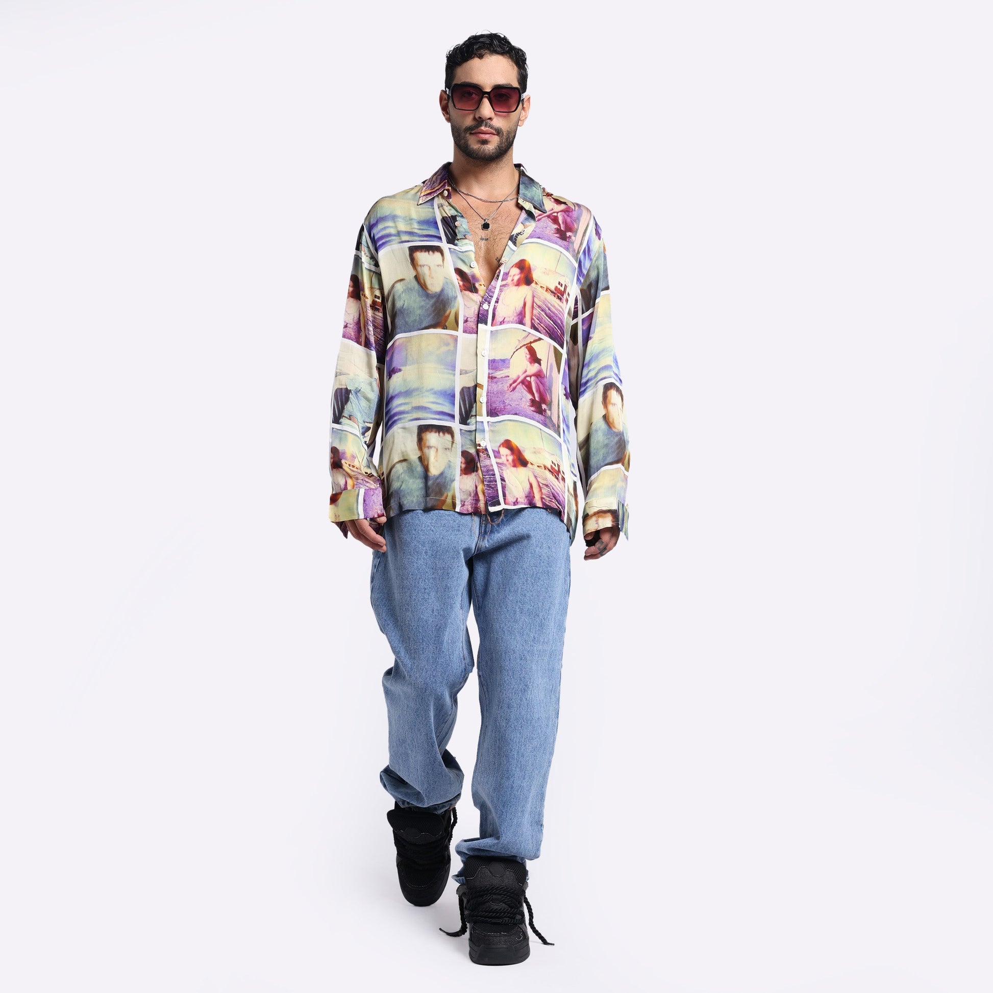 Stylera multi colored casual shirt featuring a vibrant print, paired with relaxed jeans and stylish sunglasses