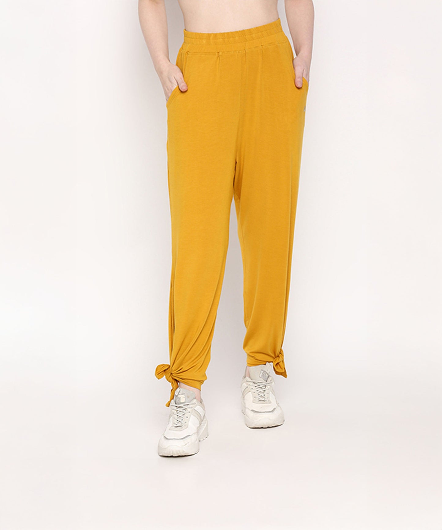 Mustard two piece set for women featuring stylish pants with adjustable tied ends