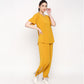 Stylish mustard two piece set for women featuring a relaxed top and tapered pants