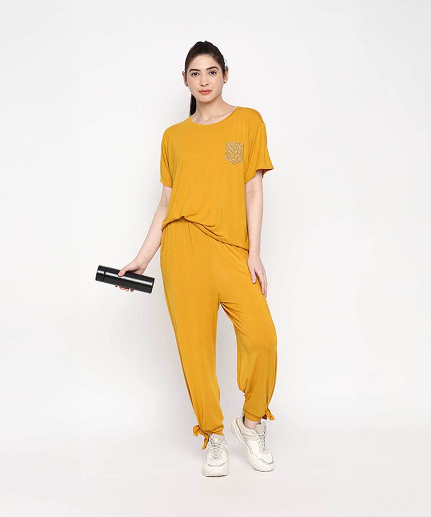 Stylish mustard two piece set for women featuring a relaxed fit top and joggers with a pocket
