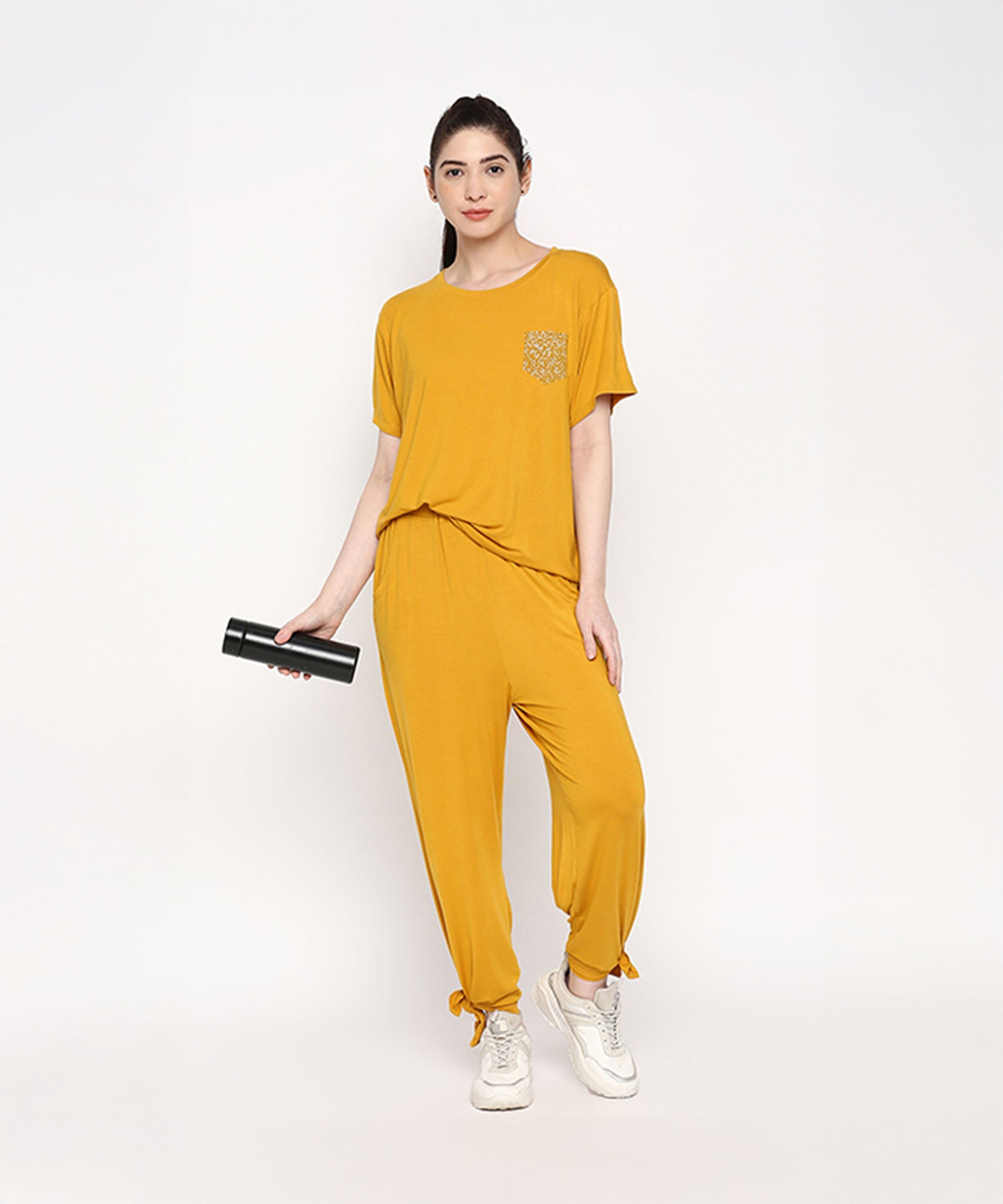 Stylish mustard two piece set for women featuring a relaxed fit top and joggers with a pocket