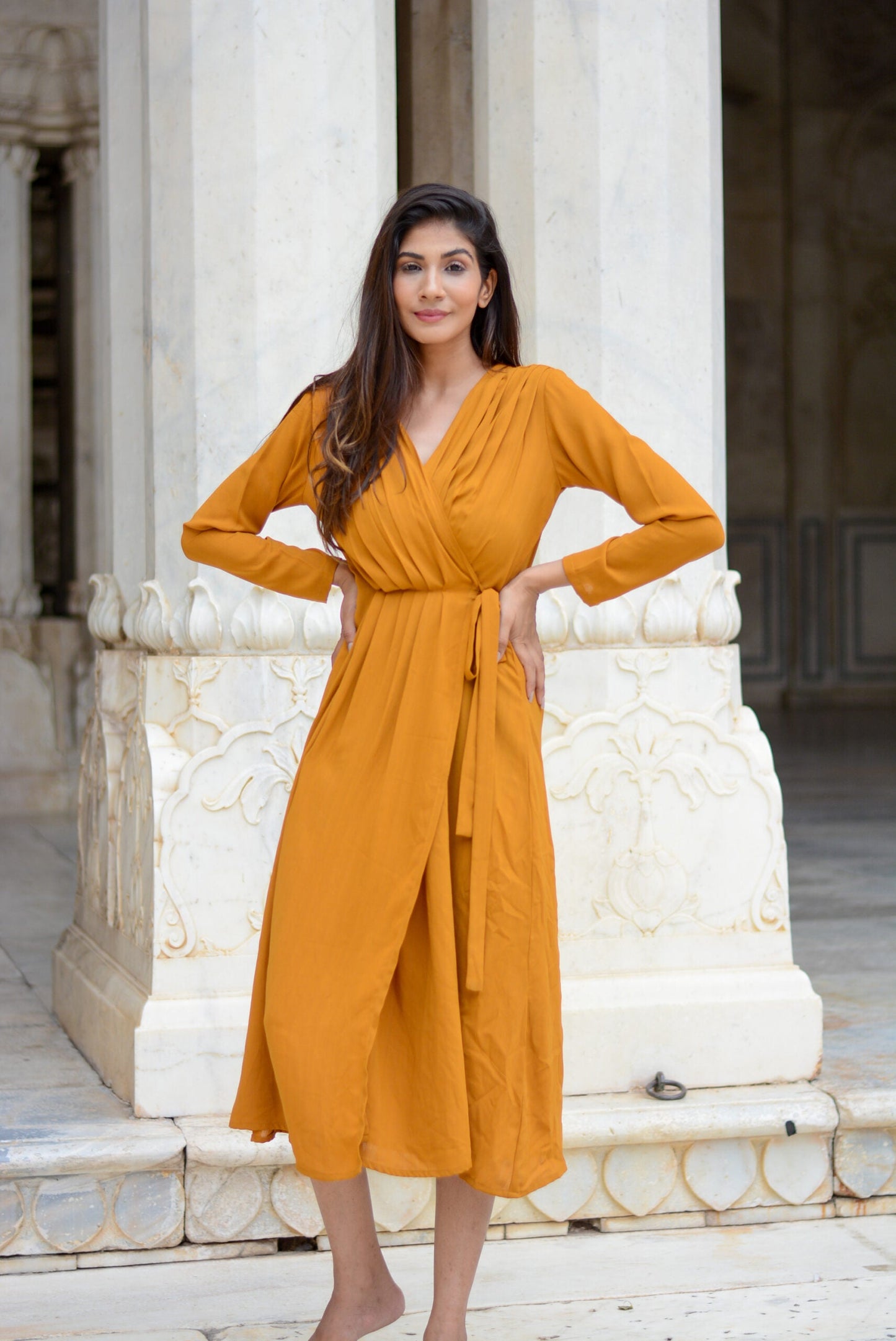 Mustard wrap dress with long sleeves and a tie waist, perfect for casual and formal occasions