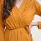 Elegant mustard wrap dress with pleats and a flattering tie waist detail