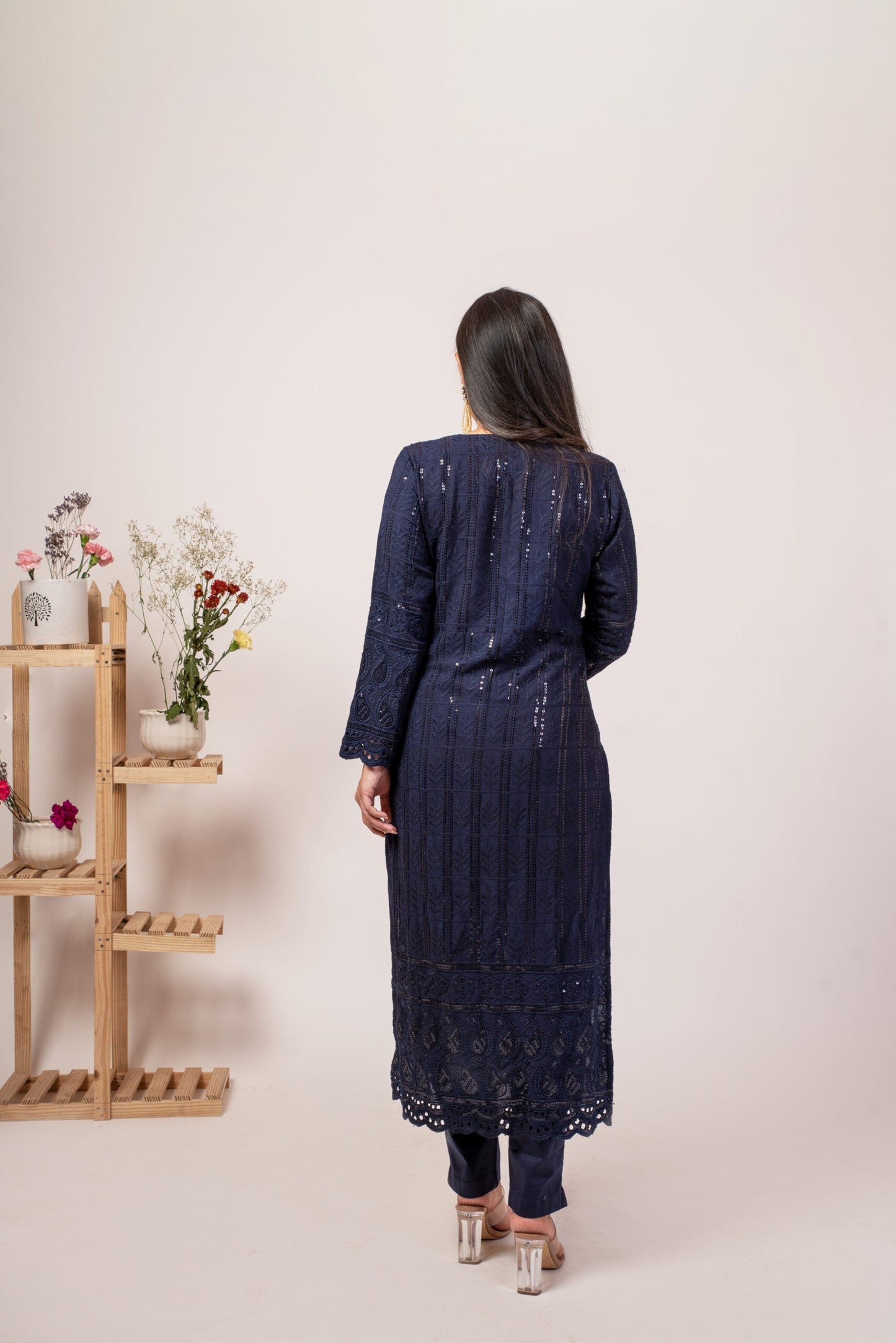 Elegant navy blue chikankari kurta set featuring intricate embroidery and a long silhouette
