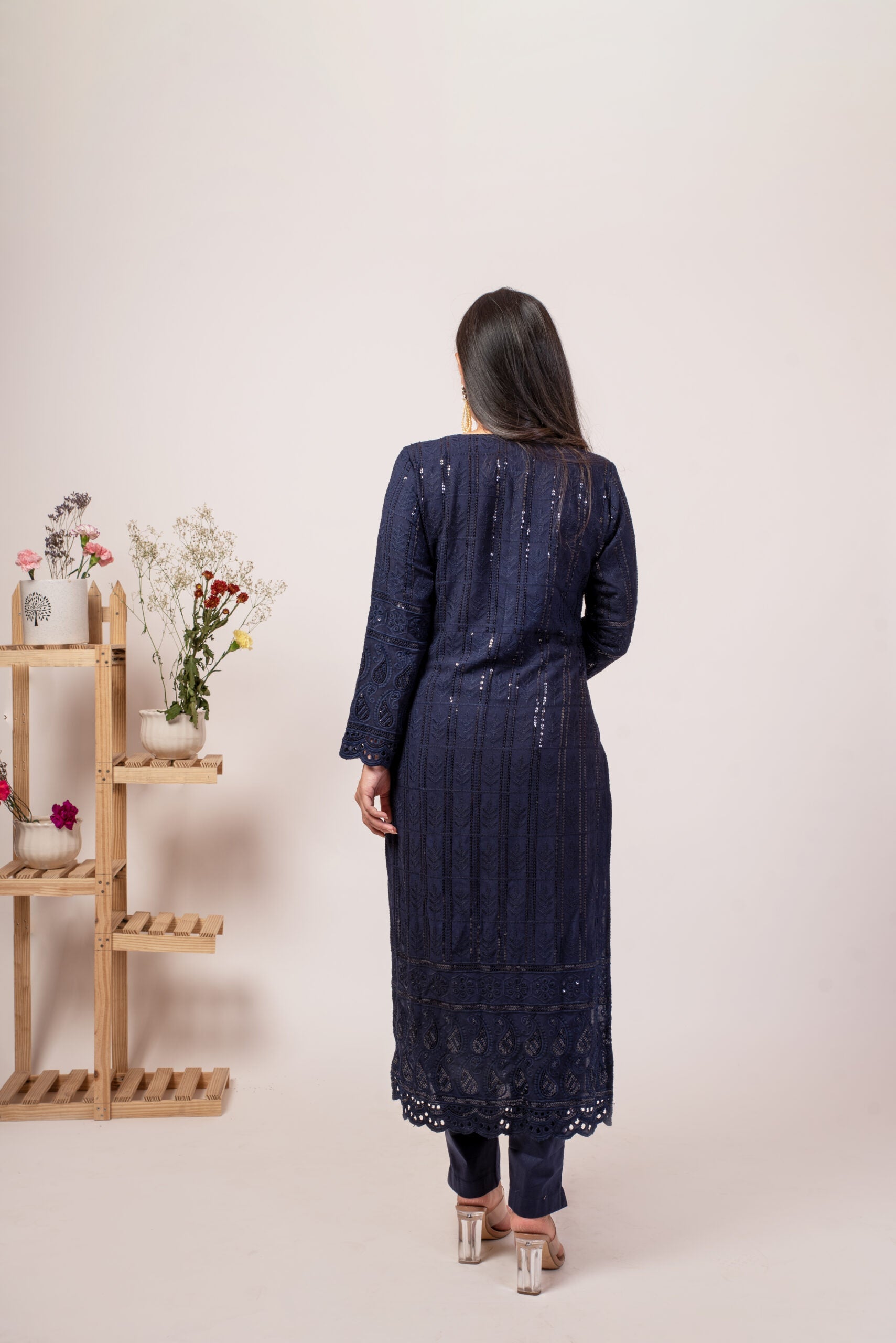 Elegant navy blue chikankari kurta set featuring intricate embroidery and a long silhouette
