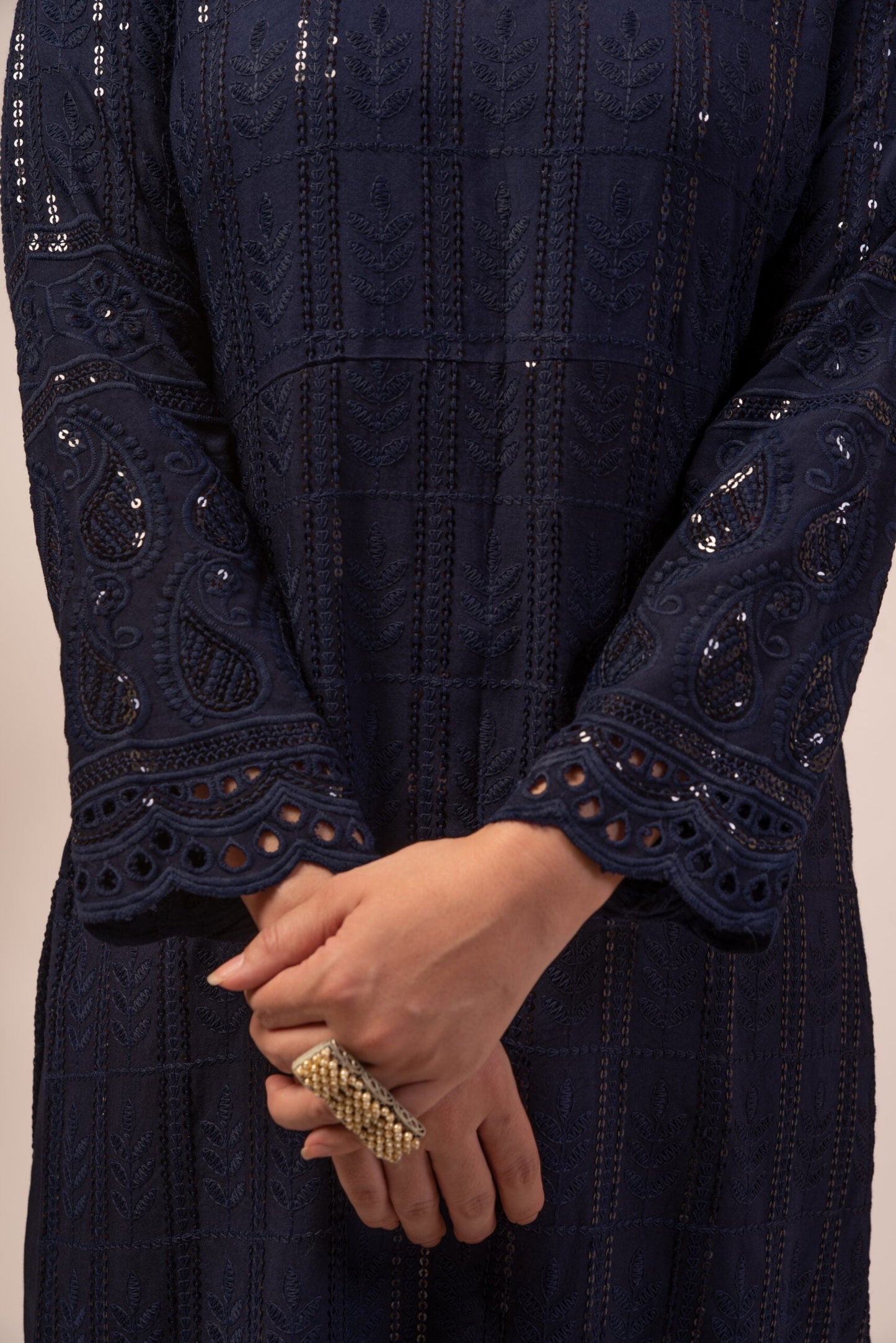 Elegant navy blue chikankari kurta set featuring intricate embroidery and detailed sleeves
