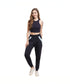 Stylish woman wearing navy blue joggers for women with a trendy cropped top and sneakers