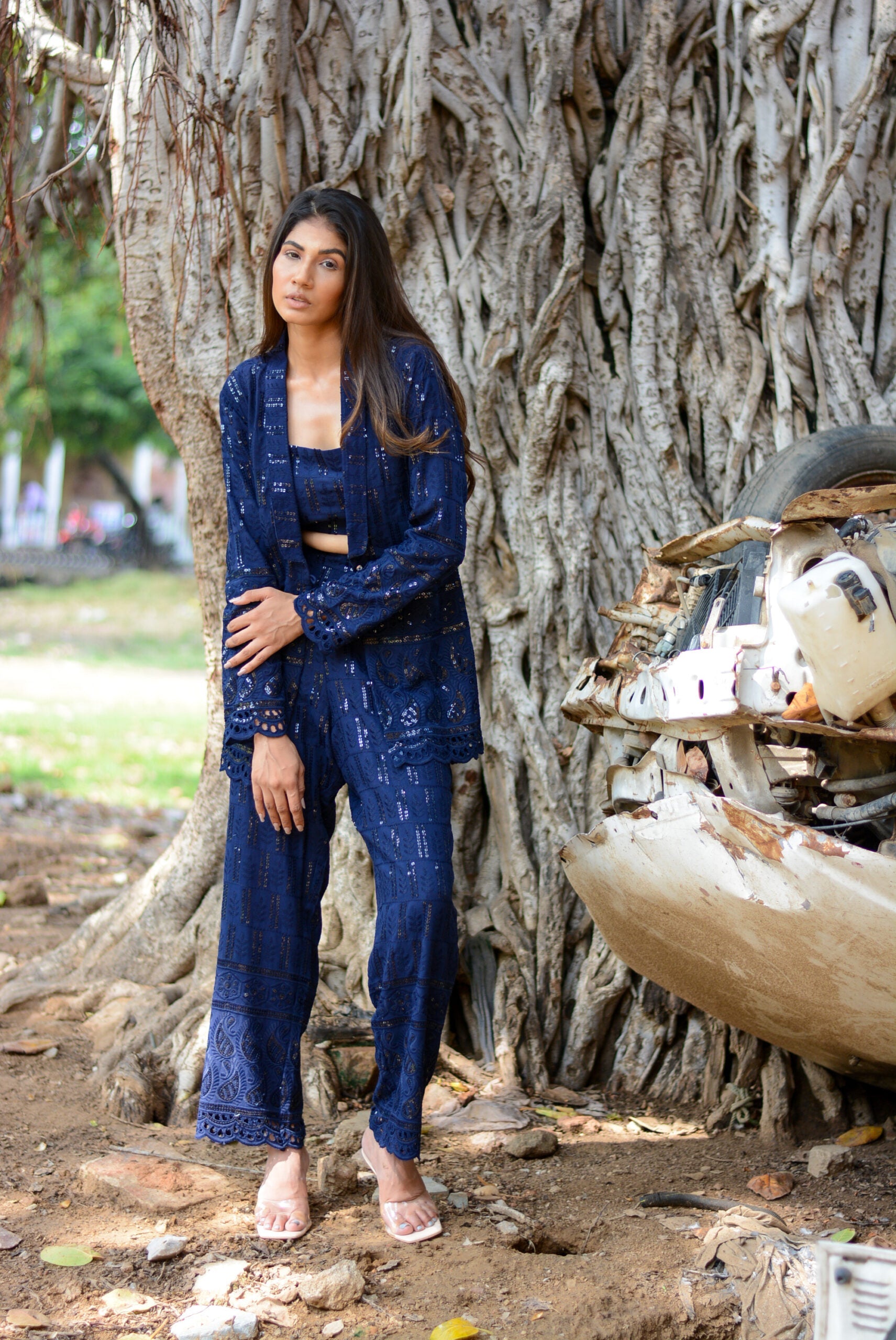 Stylish navy blue three piece co-ord set featuring a top, jacket, and pants, perfect for casual outings
