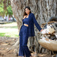 Navy blue three piece co-ord set styled with a long jacket and wide-leg pants for a chic look