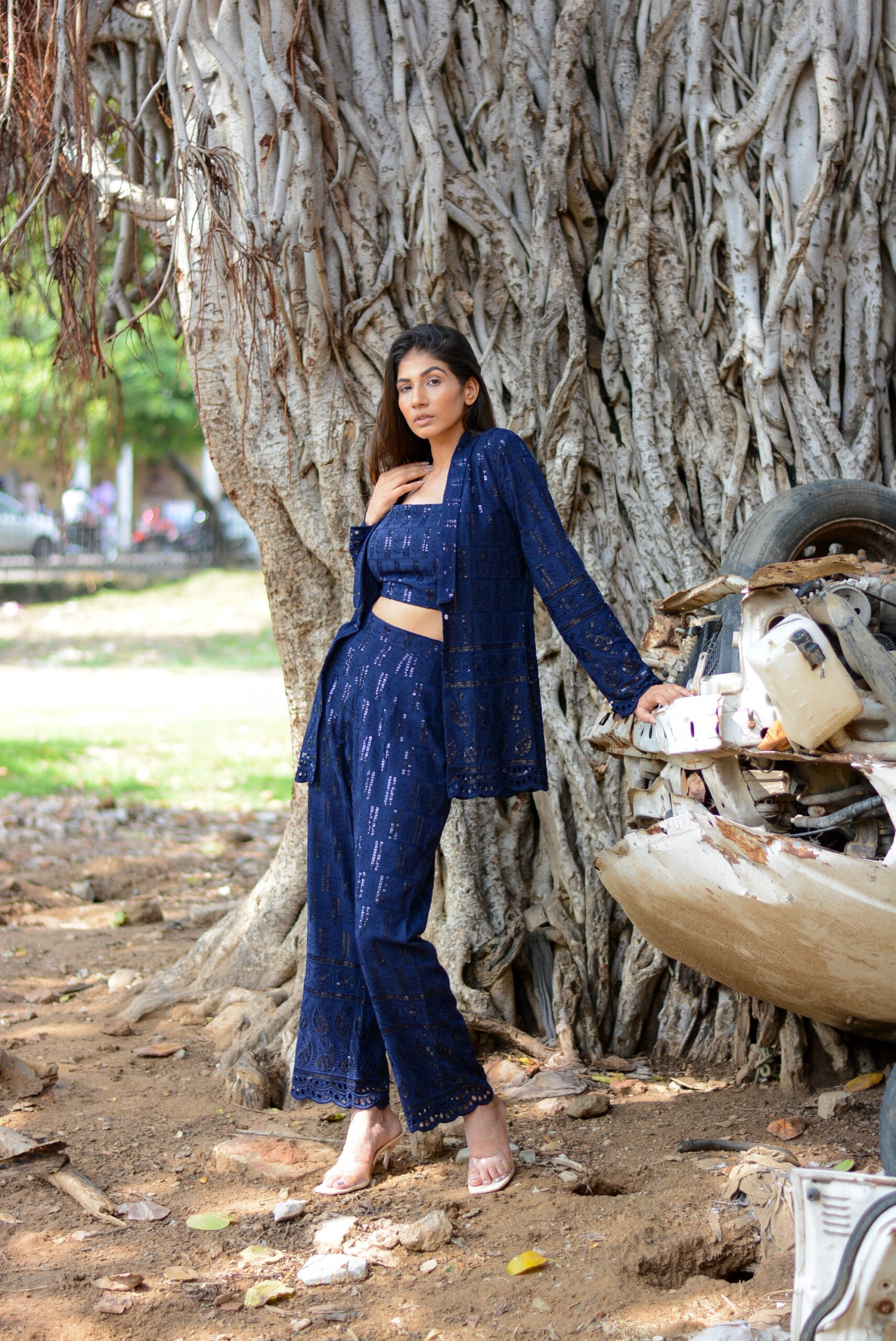 Navy blue three piece co-ord set styled with a long jacket and wide-leg pants for a chic look