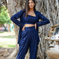 Model wearing a navy blue three piece co-ord set featuring a crop top and wide-leg pants