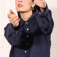 Model wearing a navy green two piece matching set with a stylish button-up shirt and relaxed fit