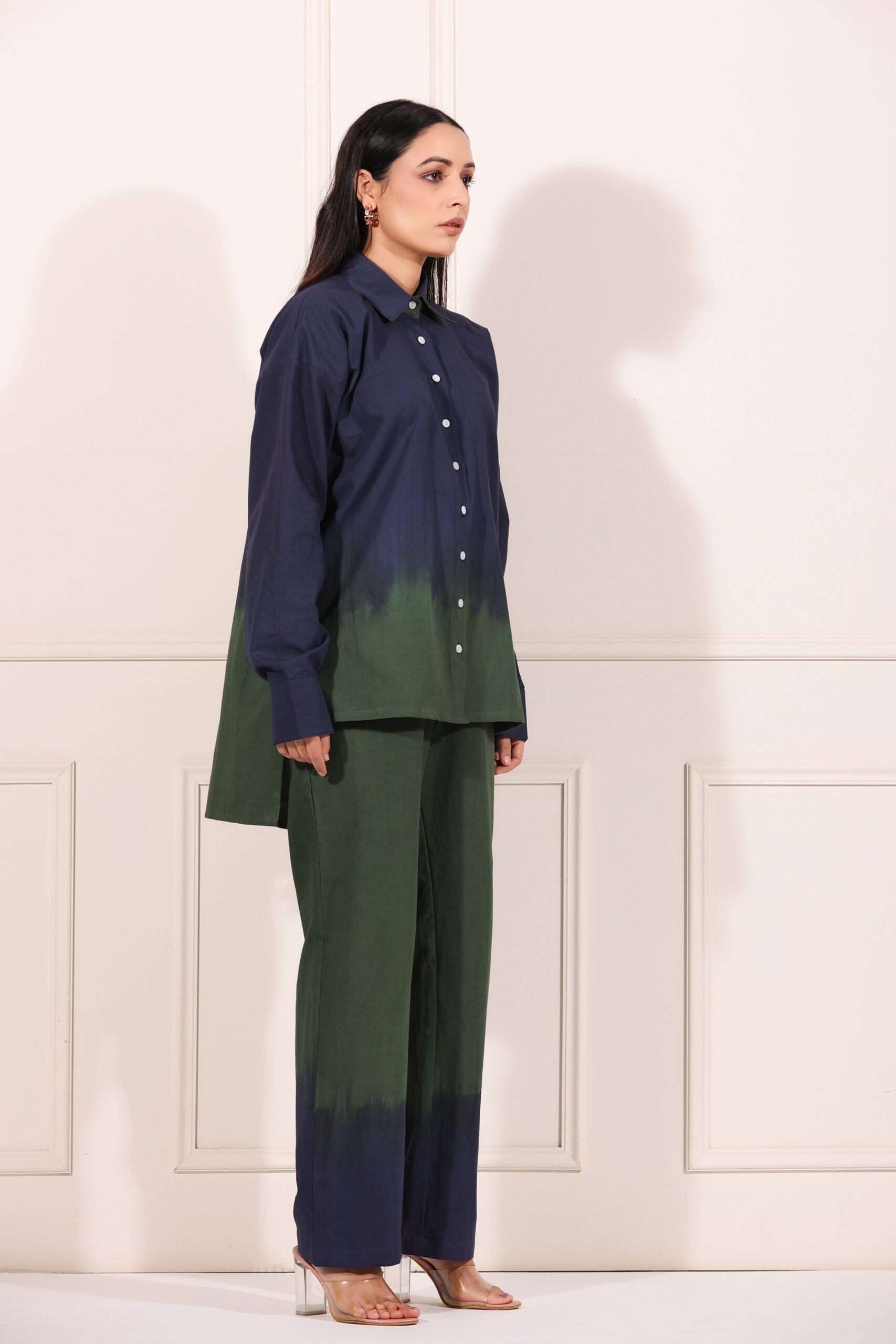 Navy green two piece matching set featuring a stylish button-up shirt and wide-leg pants