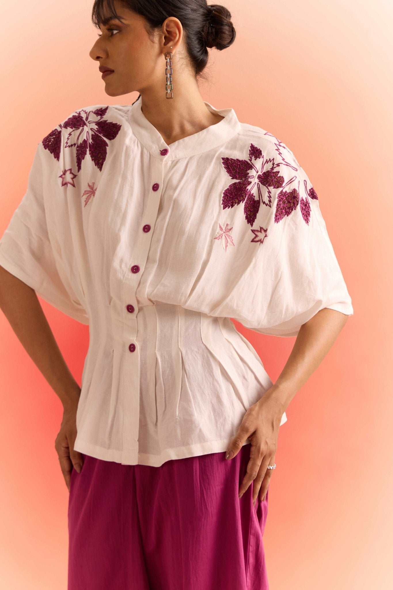 Off white embroidered cord set by Stylera featuring floral embroidery and button-up top with wide sleeves
