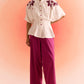 Off white embroidered cord set with floral embroidery on top and purple wide-leg pants from stylera