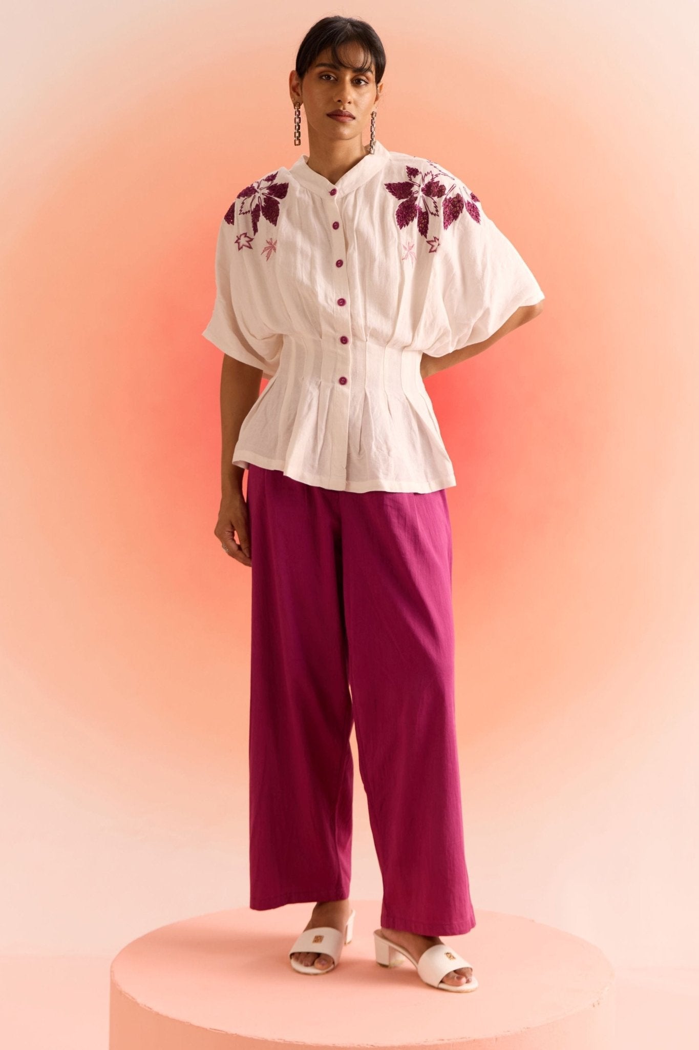 Off white embroidered cord set with floral embroidery on top and purple wide-leg pants from stylera