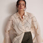 Stylera off-white oversized cotton shirt with black abstract line design and flared sleeves