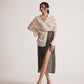 Stylera off-white oversized cotton shirt styled with olive green high slit skirt and beige heels