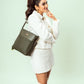 Stylish model featuring an olive green bucket bag, perfect for everyday use and fashion-forward looks