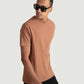 Man wearing Stylera's brown regular fit casual tee with black pants and sunglasses