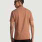 Back view of man wearing brown of Stylera regular fit casual tee paired with black pants