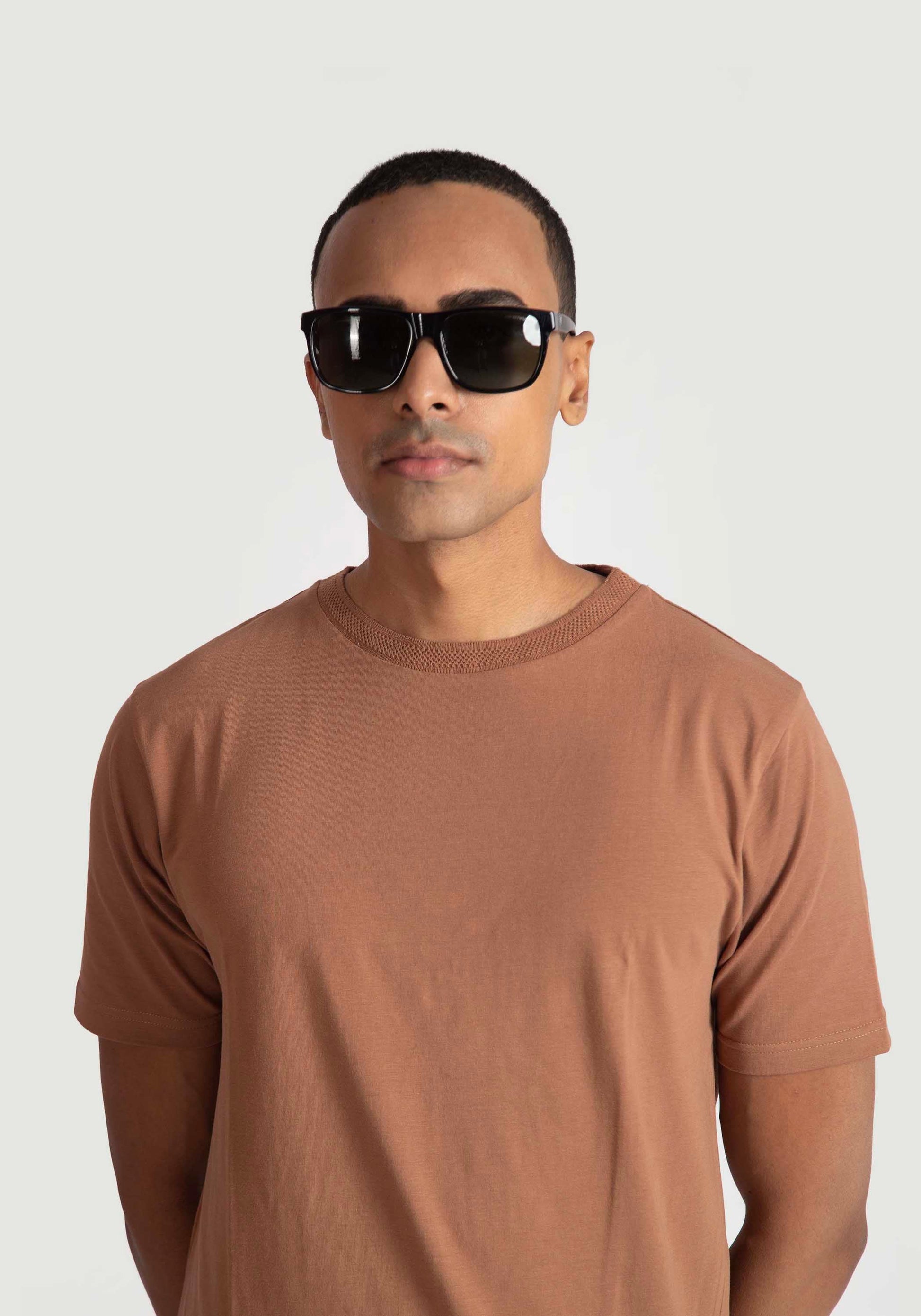 Stylera brown regular fit casual tee worn by man with black sunglasses