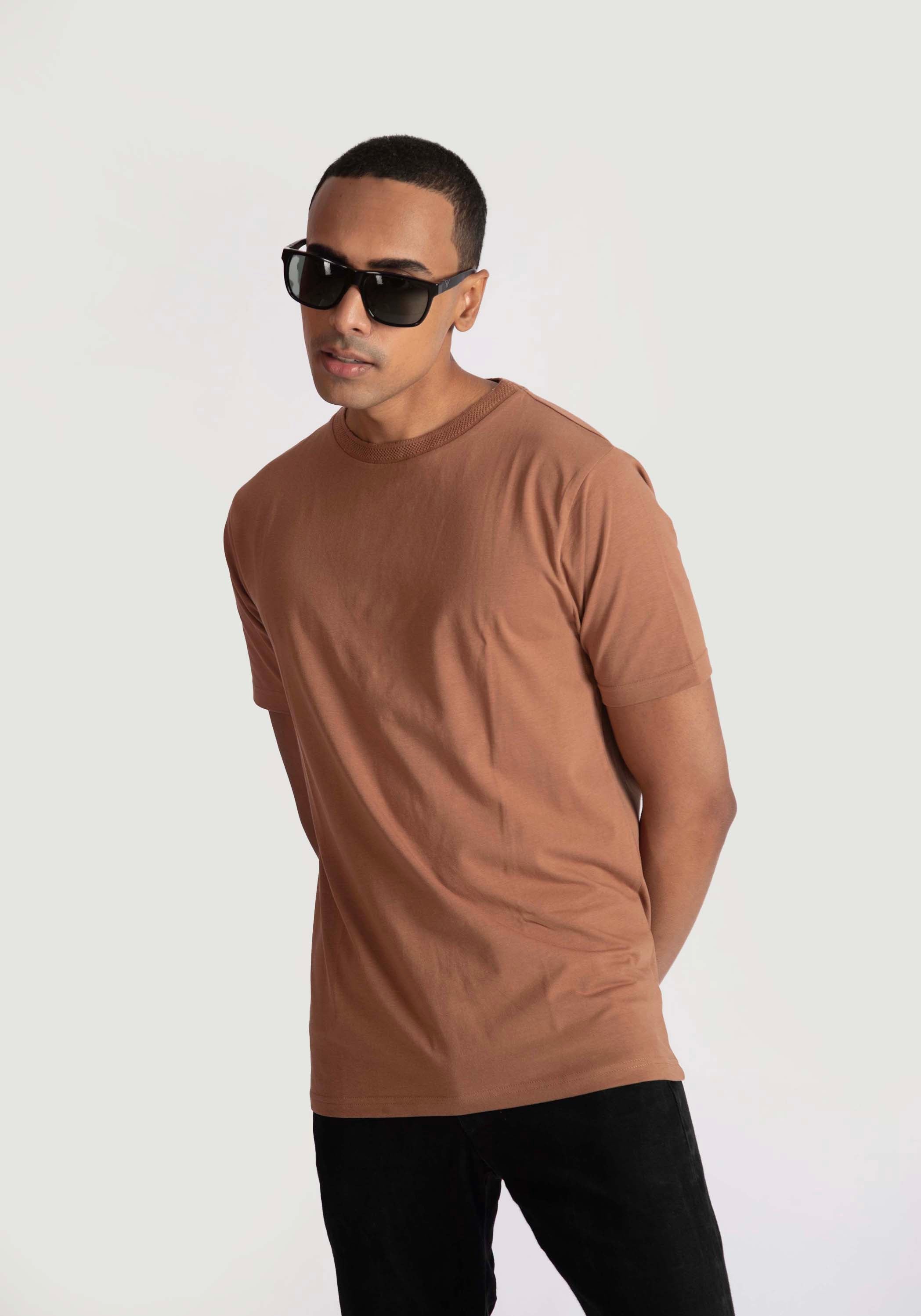 Stylera regular fit casual tee in brown worn by man with black sunglasses and black pants