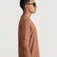 Stylera brown regular fit casual tee worn by a man in profile view with sunglasses