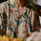 Men's oversize floral button down shirt by Stylera with vibrant flower patterns