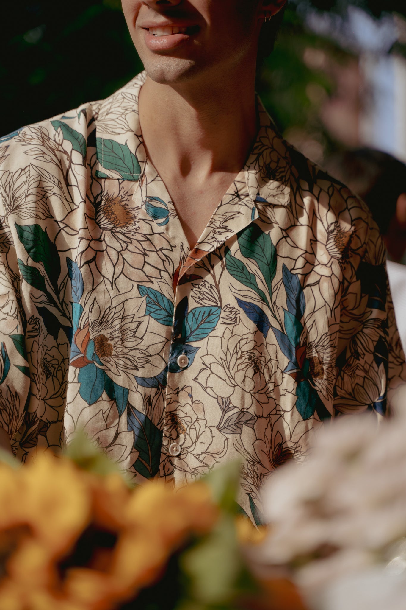 Men's oversize floral button down shirt by Stylera with vibrant flower patterns