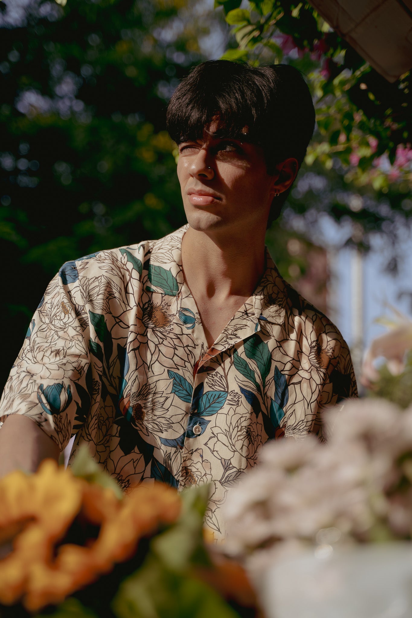 Stylish Stylera's oversize floral button down shirt featuring vibrant botanical prints for a casual look