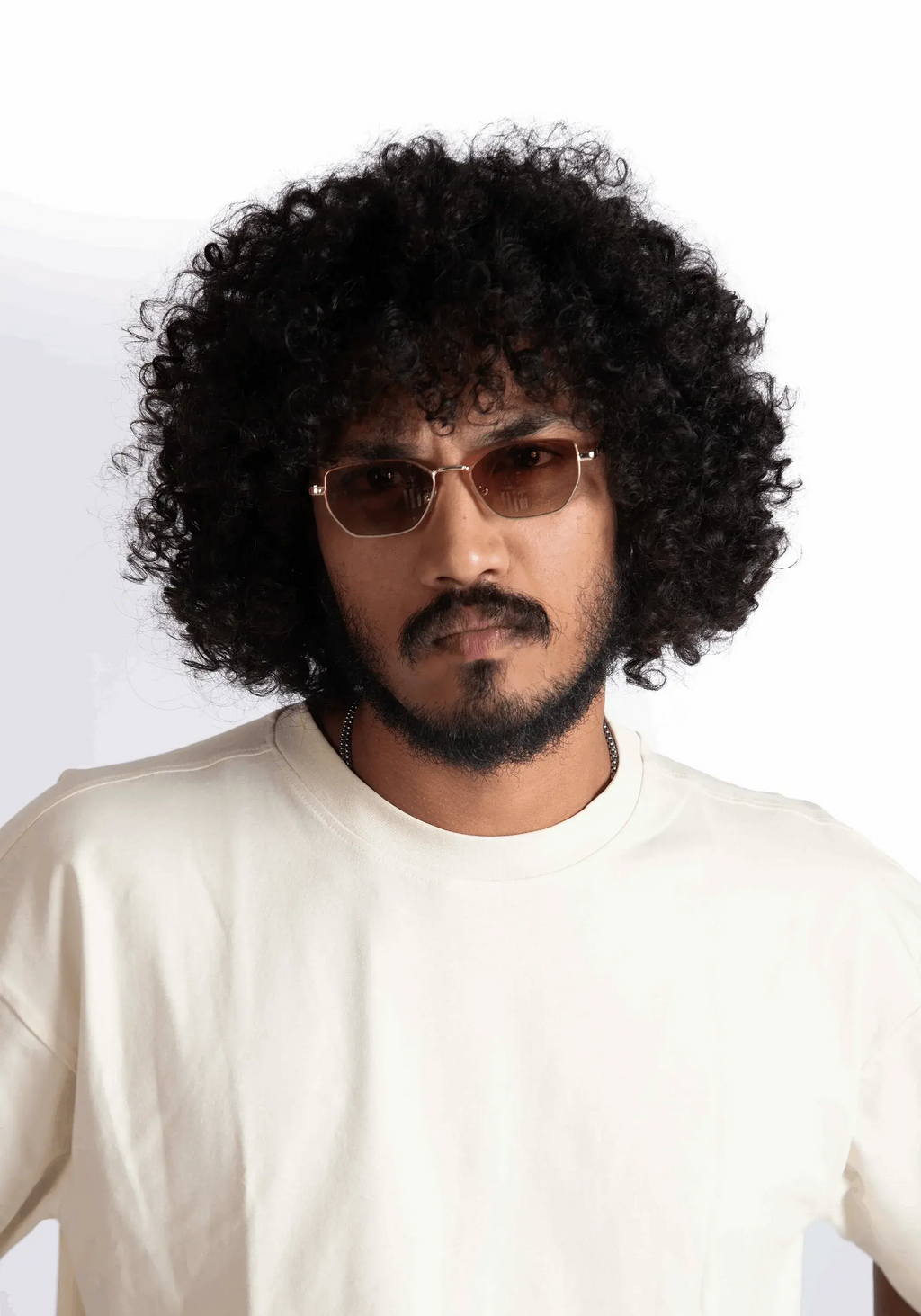 Man wearing Stylera oversized almond milk t-shirt with round neck and casual fit